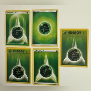 A set of grass Energy Pokemon cards.
